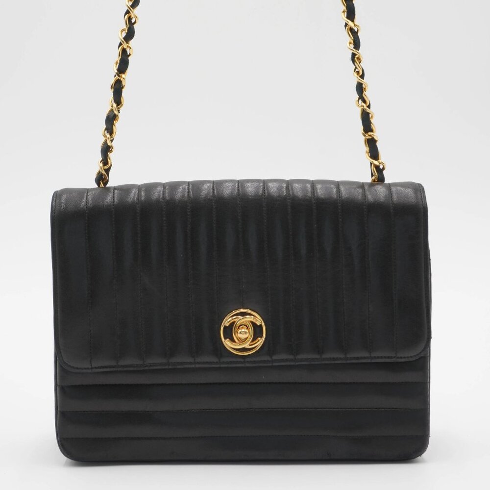SOLDPre-Owned CHANEL Mademoiselle Vertical Quilted Shoulder Bag – Black Lambskin